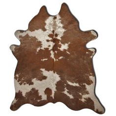 a brown and white cowhide rug on a white background