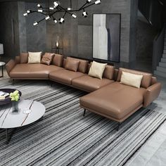 a modern living room with brown leather couches