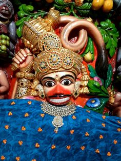 an elaborately decorated mask on display in a store