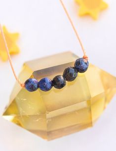 May your little one have the confidence to be themself with our Sodalite Little Wishes necklace for Confidence. Handmade by mamas, featuring contrasting orange cord, and infused with love and light. Your little one will feel so special wearing this necklace, and the keepsake card is a beautiful reminder of your love and wishes for them! Five 4mm faceted round gemstones Strung on ORANGE Mighty Miracle Cord Sterling Silver Clasp 14" long (extender not included) FSC Certified Card UL Tested and ver Infused With Love, Kids Necklace, Love And Light, Little One, With Love, Confidence, Gemstones, Sterling Silver, Orange