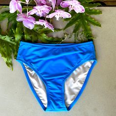 These Beautiful Powder Blue Bikini Bottom Have 3 1/2” Sides And Are Fully Lined. The Bottoms Have Moderate Rear Coverage And Come Straight Across Just Below The Waist. See Photo’s Above For Measurements. All Measurements Are Approximate With Photo’s Taken With Garment Laying Flat, No Stretch. Blue Stretch Bottoms For Poolside, Blue High-waist Bottoms For Poolside, Blue High Waist Bottoms For Poolside, High Waist Blue Bottoms For Pool, Blue Summer Bottoms For Beach Party, Blue Beachwear Bottoms For Beach Season, High Waist Blue Beachwear Bottoms, Blue High Waist Beach Bottoms, Blue Bottoms For Pool Beach Season