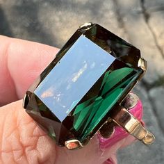 Stunning Vintage Ring In Solid 9k Yellow Gold (Stamped & Also Tested)With A Mesmerizing Deep Green Synthetic Spinel Stone. The Ring Is A Size 6.75 And Weights A Hefty 9.9 Grams !!! The Emerald Cut Green Spinel Stone Is Approx. 18 Mm X 13mm In Size . The Synthetic Deep Green Spinel Stone Unbelievably Glows Red Under Black Uv Light !!! This Ring Is Enchanting , Like A Deep Forest And Absolutely Superb !!! All Pictures Are Part Of Description. Absolutely Stunning Kapow Ring ! Large Emerald Ring, Kubler Ross, Spinel Stone, Spinel Ring, Deep Forest, Uv Light, Vintage Ring, Deep Green, Womens Jewelry Rings