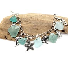 a bracelet with sea glass and charms