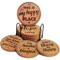 four coasters with words on them sitting on top of each other in front of a white background