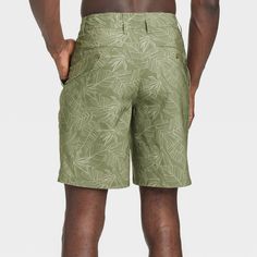 Move from the land to the sea in botanical style with these Leaf Print Hybrid Swim Shorts from Goodfellow & Co™. These hybrid swim shorts made from 4-way stretch, wrinkle-resistant fabric offer comfortable wear in or out of water. A fly button and zipper along with belt loops offers a secure fit, while the side and back pockets come in handy for stashing small essentials. Plus, the UPF 50+ rated material helps keep you protected from the sun. Pair them with your regular tees and sneakers for a c Hawaiian Style Bottoms With Built-in Shorts For Vacation, Outdoor Vacation Shorts, Vacation Outdoor Shorts, Fitted Hawaiian Style Bottoms For Poolside, Casual Vacation Shorts For Outdoor, Green Hawaiian Summer Bottoms, Summer Outdoor Bermuda Bottoms, Bermuda Bottoms For Outdoor Summer Activities, Bermuda Bottoms For Summer Outdoor Activities