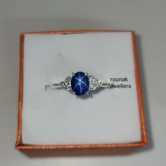 BAND- ROUNAK JEWELLERS MATERIAL- 925 STERLING SILVER GEMSTONE - LAB BLUE STAR SAPPHIRE BLUE STAR STONE WEIGHT - 2.15 CARAT BLUE STARSTONE SIZE -7.90X 6 MM SECONDARY STONE - CUBIC ZIRCONIA ZIRCONIA STONE WEIGHT - 0.14 CARAT ZIRCONIA STONE SIZE - 1.70 MM GROSS WEIGHT - 3.160 GM STONE SHAPE - OVAL, ROUND GEM COLOUR - BLUE, WHITE PLEASE GIVE YOUR OPENION OR FEEDBACK ABOUT THE PRODUCT. WE ACCEPT BULK ORDER ALSO. https://www.etsy.com/in-en/shop/RounakJewellers?ref=search_shop_redirect Sterling Silver Sapphire Star Jewelry, Silver Celestial Jewelry With Center Stone, Celestial Silver Jewelry With Center Stone, Star-shaped Sapphire Ring As Gift, Star-shaped Sapphire Ring For Gift, Star Shaped Sapphire Jewelry For Anniversary, Blue Star Sapphire Ring, Star Sapphire Ring, Blue Star Sapphire