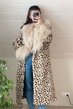 Stay warm and stylish in winter in this Leopard Print Faux Fur Coat. Super soft and thick faux fur and fluffy collar and cuffs make this coat cozy and warm. Beige Faux Fur Coat For Fall, Leopard Print Outerwear With Faux Fur Trim, Leopard Print Faux Fur Coat With Lining, Leopard Print Fur Coat With Faux Fur Trim, Oversized Faux Fur Long Coat, Fluffy Beige Fur Coat For Fall, Long Faux Fur Coat With Faux Fur Lining, Long Faux Fur Coat For Winter, Winter Beige Faux Fur Coat