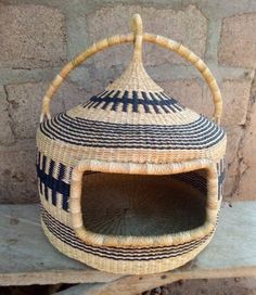 a woven basket sitting on top of a wooden bench