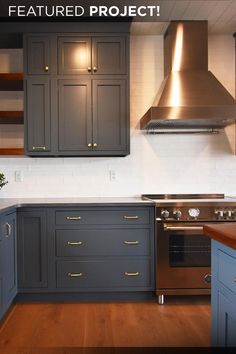 an image of a kitchen setting with wood flooring and cabinets on the wall above