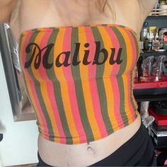 Womens Size Small / Medium Malibu Tube Top With Flattering Vertical Stripes. Comes All The Way Down To The Belly Button, Is Double Lined. Never Worn. It Has A Worn Look But It Was Purchased That Way New. No Stains Tears Or Rips. Y2k Multicolor Beach Tops, Fun Fitted Beach Top, Multicolor Fitted Top With Letter Print, Fitted Multicolor Top With Letter Print, Summer Fitted Tops With Letter Print, Fitted Multicolor Tops With Letter Print, Fun Fitted Top For Beach Season, Fun Fitted Tops For Beach Season, Fitted Letter Print Summer Tops