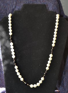 Vintage black and white pearl necklace with hinged clasp.  12 inch in length and designed as a high-end fashion accessory in the 1950s. Classic Beaded Pearl Necklace For Evening, Classic Black Pearl Drop Necklace, Classic Black Beaded Necklaces, Black Pearl Evening Necklace, Classic White Evening Necklaces, Classic White Evening Necklace, Classic White Necklace For Evening, Black And White Pearl Necklace, Beaded Jewelry Necklaces