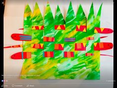 an art project with fish and trees made out of construction paper