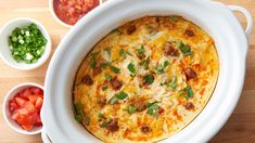 a casserole dish with meat, cheese and vegetables