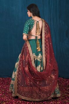 Green attached cancan lehenga adorned with beautiful dabka, nakshi, moti, zari, sequin and cutdana work. Paired with  embroidered padded blouse. Comes with maroon dupatta adorns with zari, sequin cheeta and moti work and green veil dupatta. - Aza Fashions Designer Art Silk Sharara With Tilla Details, Art Silk Dupatta With Tilla For Reception, Reception Art Silk Dupatta With Tilla Detail, Designer Chanderi Lehenga With Tilla Embroidery, Designer Chanderi Dupatta With Tilla, Designer Bollywood Choli With Tilla Detailing, Bollywood Style Designer Choli With Tilla, Festive Reception Sets With Tilla Details, Designer Wear Transitional Dupatta With Tilla