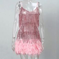 This Tassel & Feathers Party Mini Dress will help you make a statement at your next event. This spaghetti strapped dress is perfect for the summertime and is finished with bright pink feathers and tassels. Showcase your unique sense of style and make a memorable impression. Fit Type: Regular Fit Fabric: Non-Stretch Material: Polyester Feather Mini Dress, Streetwear Dress, Dresses Ladies, Bandage Dress Bodycon, Spaghetti Strap Dress, Necklines For Dresses, Pink Mini Dresses, Strap Dress, Waist Dress