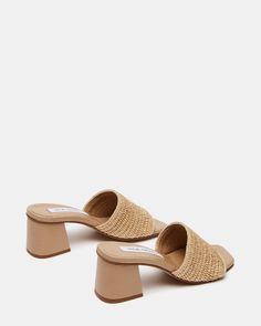 CLEAN + CHIC + SUNNY An easy slide with a comfortable square toe and block heel, the RAIA sandal features a wide woven raffia strap for a textured finish. Square toe block heel slide sandal Slip-on style Wide woven raffia strap Angled block heel 2.75 inch heel height Synthetic upper material Vegan leather lining Synthetic sole Imported Block Heel Mule, Woven Raffia, Slide Sandals, Sunnies, Block Heels, Vegan Leather, Heel Height, Slip On, Sandals