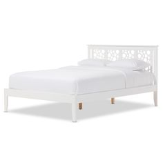 a white bed with an open headboard and foot board on the bottom side, in front of a white background