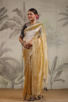 Shop yellow tissue silk sari online in USA with embroidered blouse. Make a fashion statement on festive occasions and weddings with designer suits, Indian dresses, Anarkali suits, palazzo suits, designer sarees, sharara suits, Bollywood saris from Pure Elegance Indian fashion store in USA.-full view Yellow Semi-stitched Cotton Silk Saree, Festive Yellow Tussar Silk Pre-draped Saree, Yellow Bollywood Cotton Silk Pre-draped Saree, Designer Yellow Saree With Sheer Dupatta, Yellow Chanderi Saree With Sheer Dupatta, Yellow Dola Silk Blouse Piece With Sheer Dupatta, Yellow Dola Silk Pre-draped Saree For Party, Yellow Bollywood Style Blouse In Tussar Silk, Gold Cotton Silk Saree For Party