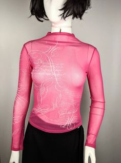 "Very nice vintage 90s turtleneck mesh top long sleeve tattoo abstract pattern from KENZO Junior. Cool for rave and everyday look. Size 16 tag, fits XS-S best (see measurements ) Condition 10/10 Underarm to underarm - 39.5 cm/15.5\" (the mesh stretches) Length from the back - 50 cm/19.7\" (the mesh stretches) Sleeve length - 68 cm/26.7\" (the mesh stretches) All measurements taken with garment lying flat. Vintage sizes vary greatly! We recommend comparing measurements with a similar style garmen Y2k Mesh Top With Graphic Print, Trendy Graphic Print Mesh Top, Trendy Mesh Top With Graphic Print, Fitted Long Sleeve Mesh Top For Streetwear, Spring Y2k Sheer Mesh Top, Sheer Y2k Mesh Top For Spring, Sheer Mesh Top Y2k Style For Spring, Pink Fitted Mesh Top, Fitted Pink Mesh Top