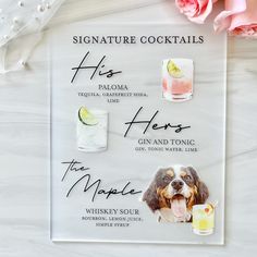 a sign with different types of drinks on it next to pink flowers and glasses that say, signature cocktails his hero gin and tonic