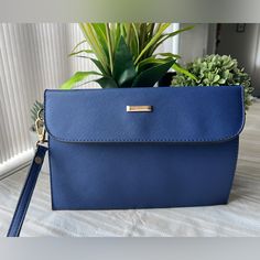 Nwot Elim And Paul Large Wristlet/Clutch Faux Leather Blue Exterior And Red Interior Removable Strap 10” X 7” No Callouts Comes From A Smoke Free Home Trendy Blue Clutch For Formal Occasions, Blue Bags With Wrist Strap For Daily Use, Blue Rectangular Bag With Wrist Strap, Blue Elegant Wristlet For Everyday Use, Elegant Blue Pouch Wristlet, Elegant Blue Wristlet For Everyday Use, Louis Vuitton Speedy Bandouliere, Blue Exterior, Bucket Purse