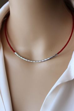 This trendy minimalist choker necklace was made of red glass seed beads, silver tone hematite stone beads, two layers of strong nylon thread, stainless steel end clasps, stainless steel lobster claw and stainless steel chain. Perfect jewelry for everyday wear! PLEASE NOTE: The silver tone pendant necklace is not included in the price and serves as an example of how you can combine other necklaces with this short necklace, but it is also available in my store. The length of necklace is about 41.5 Trendy Pendants, Seed Beads Necklace, Beads Choker, Diy Jewelry Inspiration, Beaded Necklace Diy, Hematite Stone, Red Necklace, Silver Bar, Trendy Necklaces