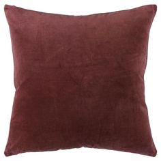 a brown pillow on a white background