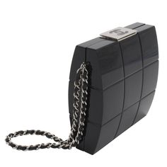 Black lucite Chanel clutch with matte silver-tone hardware, chain and woven leather handle at side, interlocking CC at top, quilted motif throughout, single interior wall pocket and top push-lock closure. The wrist strap can be tucked away inside to easily convert this piece from wristlet to clutch. This is a very rare limited edition piece that is no longer produced or sold in stores. Interior lined in black leather. Good condition, some light surface scratches. Serial number 7465622 Measuremen Chanel Clutch, Chanel Brand, Blue Clutch, Vintage Clutch, Handbag Heaven, Wristlet Purse, Vintage Purses, Interior Wall, Chanel Bags