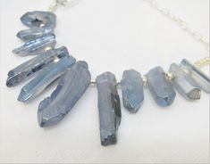 "I LOVE these LUSTER FINISH IRREGULAR GRADUATED SPIKES--I am not sure if they are glass or stone with a coating. They look like natural stone, but the finish is not quite like anything I have seen before. The color is a soft blue to blue-gray, and while each piece LOOKS rough and irregular, the finish is very smooth and glassy and shimmery. The beaded section of this necklace is a fan of these beads about 7\" wide. The shortest pieces are about 1\" long and the longest about 2\" long. It has a v Adjustable Blue Jewelry With Raw Stone, Adjustable Blue Raw Stone Jewelry, Adjustable Raw Blue Stone Jewelry, Useable Gifts, Star Wars Theme Party, Farmers Market Bag, Spike Necklace, Tote Outfit, Free Gift Tags