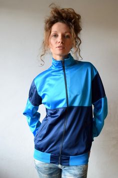 Blue workout jacket, Vintage jacket, Color block running jacket, Men outdoor jacket, Sport outerwear,Outdoor sportswear,Blue windbreaker,S/M Blue vintage sport jacket made in Finland. It has two side pockets with zipper closure and turtle neck what will protect you if it's windy outside. Dark and light blue color blocks will make your look more interesting and workouts or any activities more fun! Size: seems like women (M) and men (S) PLEASE CHECK ALL MEASUREMENTS BELLOW: Length: 63 cm/ 25" Shou Affordable Blue Nylon Windbreaker, Cheap Vintage Blue Windbreaker, Blue Functional Winter Track Jacket, Blue Functional Track Jacket For Winter, Functional Winter Gym Tracksuit, Athleisure Windproof Windbreaker For Gym, Athleisure Windproof Gym Windbreaker, Stretch Nylon Track Jacket For The Gym, Stretch Functional Windbreaker For Gym