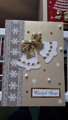 two christmas cards with gold bows and snowflakes