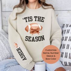 This pullover crewneck sweatshirt is perfect for a chilly morning football game day, cheering on your favorite team! If your a mom, a grandma, a sister, an Aunt, or anyone with someone in the game, customize the Sleeve with their name or their name and number to show your love!  The personalization box is right above the "add to cart" button! Here are some more football items in the shop: https://www.etsy.com/shop/LovelyJaynesBoutique?ref=seller-platform-mcnav&section_id=33580348 Not finding wha Team-colored Hoodie For Game Day In Fall, Game Day Hoodie With Ribbed Cuffs For Fall, Fall Game Day Hoodie With Ribbed Cuffs, Fall Hoodie With Ribbed Cuffs For Game Day, Ribbed Cuffs Hoodie For Game Day In Fall, Winter Game Day Fan Apparel Sweatshirt, Sports Fan Tops For Game Day In Winter, Winter Sports Fan Top For Game Day, Fall Team Spirit Hoodie Fan Gear