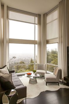 a hotel room with a balcony overlooking the water