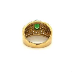 Vintage tsavorite and diamond cluster ring in 18k solid gold. Featuring a richly colored oval cut green and round cut diamond side stones. Mounting in a two-toned solid gold setting.   Tsavorite is a rare form of Garnet called Green Grossularia.   Item Details: - Type: Vintage Ring  - Metal: 18K White, Yellow Gold  - Weight: 12.2 grams  - Setting: Prong  - Size: 8  _____________________________  Center Stone Details: - Type: Tsavorite  - Carat: 1.50 (approx.) - Cut: Oval  - Color: Green  - Measu Oval Tsavorite Diamond Ring For Formal Occasions, Brilliant Cut Oval Diamond Ring With Tsavorite, Luxury Green Oval Cluster Ring, Green Oval Diamond Ring Fine Jewelry, Green Multi-stone Oval Diamond Ring, Oval Green Multi-stone Diamond Ring, Green Oval Multi-stone Diamond Ring, Green 14k Stamped Diamond Ring, Oval Tsavorite Multi-stone Ring