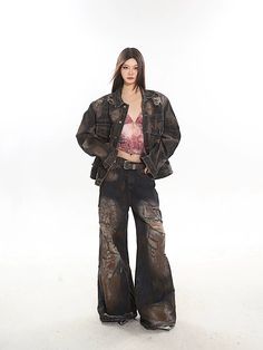 These vintage destroyed grunge jeans feature a relaxed bootcut flare and a rust paint distressed wash. The ripped and shredded detail adds a touch of edginess to your look. Relaxed bootcut flare Vintage grunge-inspired style Rusty, worn-in distressed wash Tattered rips with shredded accents Model is 5'4 95lbs wearing M