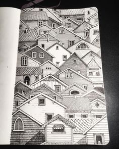 a notebook with houses drawn on it