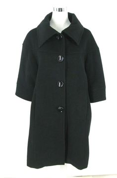 Express A-Line Swing Black Coat  New with Tags. Half Tag. Not a full tag. see picture MSRP of this coat is $298 (but price has been cut off tag)  A-Line / Swing Style. BUT NOTE....this is NOT an exaggerated Swing.  There is NO Kick Pleat in the back. But does have a looser / A- Line fit.  Retro Styling...Jackie O / Mad Men / 1960's Style Wider Width Sleeves hitting at / right below the Elbow.  Black Soft Luxurious Feeling Wool Silk Poly Blend Fabric Mid Weight. Great for Work or Evening  Fully L 1950s Coat, Black Dress Coat, 1960's Style, Kick Pleat, 1960s Fashion, Vintage Shorts, Mad Men, Fall Winter Outfits, Black Wool