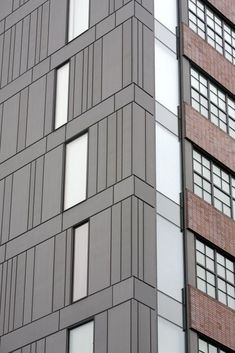 the side of a tall building with many windows