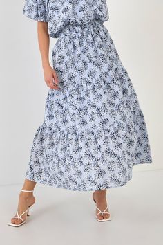 The perfect skirt for a summer day. This tiered maxi skirt is perfect for a summer day. With an elastic waistband and shirring throughout, it's comfortable and flattering. You'll love the pretty floral print too. Style this skirt with sandals or wedges for a casual look, or dress it up with a blouse and heels. Tiered maxi skirt Elastic waistband Shirring throughout Hand wash cold Do not bleach Do not tumble dry Iron low Shell: 100% Cotton Lining: 80% Polyester 20% Cotton TL645K Total lenght:37.5 Summer Floral Print Voluminous Maxi Skirt, Floral Print Voluminous Maxi Skirt For Summer, Voluminous Floral Print Maxi Skirt For Summer, Tiered Floral Print Flowy Maxi Skirt, Tiered Flowy Floral Maxi Skirt, Spring Floral Print Tiered Maxi Skirt, Tiered Floral Print Maxi Skirt, Tiered Floral Print Skirt, Flowy Tiered Floral Print Skirt