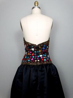 "This is a an absolutely gorgeous vintage evening gown beautifully detailed with multicolored jewels, beads and sequins. It's in perfect condition! Bust - 36/38\" Waist - 28/30\" Hips - free Total Length - 55\" Tag Size - 10 (please refer to measurements) This dress comes from a pet-free and smoke-free home. If you would like more info or have any questions, please don't hesitate to ask!" Multicolor Sequined Evening Dress For Gala, Multicolor Sequined Evening Dress For Prom, Multicolor Embellished Dresses For Formal Occasions, Multicolor Embellished Formal Dresses, Formal Multicolor Embellished Dresses, Glamorous Multicolor Cocktail Evening Dress, Embellished Multicolor Evening Dress, Multicolor Embellished Evening Dress, Elegant Multicolor Embellished Evening Dress