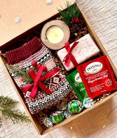 a box filled with christmas items on top of a table