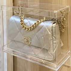 a chanel bag hanging on the wall