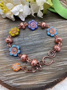 Bracelet Flowers Multi Color Czech Glass Adjustable Free Shipping Copper Wire Wrap, Flower Charm ~ metallic copper lava beads ~ hand forged copper clasp ~ easy on and off ~ fun to wear Your treasure will arrive ready for gift giving or your own pleasure. Thanks for shopping we value and appreciate your business! Wire Wrap Flower, Trendy Jewelry Ideas, Bracelet Flowers, Czech Beads Jewelry, 2024 Jewelry, Pink Tourmaline Crystal, Crystal Spikes, Spike Hoop Earrings, Jewelry Repurposed