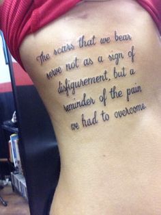 a person with a tattoo on their back that says, the scars that we bear were not as a sign of disfigment