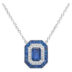 A stunning pendant necklace, featuring a 0.80 carat emerald cut blue sapphire, bezel-set on platinum. Surrounded by a double halo of diamonds weighing 0.05 carat total and trapezoid shape blue sapphires weighing 1.39 carats total. Finished with milgrain edges. Suspended on an adjustable platinum chain, 18 inches in length.  Available in matching earrings and ring. Please inquire about items DEAR1706 and EM973SA.  Roman Malakov is a custom house, specializing in creating anything you can imagine. Blue Emerald Cut Fine Jewelry Necklace, Blue Emerald Cut Necklace Fine Jewelry, Blue Diamond Cut Platinum Necklace, Blue Platinum Necklace With Brilliant Cut, Blue Brilliant Cut Platinum Necklace, Blue Emerald-cut Baguette Diamond Jewelry, Trapezoid Shape, Sapphire Diamond Pendant, Platinum Chain