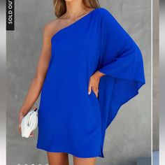 Questions? Leave A Comment Below! Blue One-shoulder Dress For Vacation, Blue Flowy Chic Mini Dress, Solid Color One Shoulder Vacation Dress, Elegant One-shoulder Mini Dress For Vacation, One-shoulder Dress For Vacation, One-shoulder Vacation Dress, Solid Color One-shoulder Vacation Dress, Elegant Blue Mini Dress For Beach, Royal Blue One-shoulder Dress For Night Out