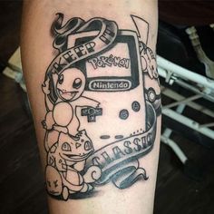 a person with a tattoo on their leg that has an image of a nintendo game console