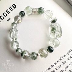 Green Phantom Quartz design with 925 silver bead Support your energy for career development. The bracelet is design in 15.5-16cm, if you need to adjust the size please let us know :) EMBRACE THE CREATION OF MOTHER NATURE Every piece of crystal is the creation of nature, there might be slightly difference and nature inclusion. We try our best to control every item same with the photo shown. FOLLOW US! Follow us on Facebook and Instagram to get updates: @PhenixCrystalShop VISIT US! Come to visit u Modern Silver Bracelets With Gemstone Beads, Casual Silver Bracelets With Gemstone Beads, Handmade Silver Crystal Bracelet For Meditation, Casual Silver Round Crystal Bracelet, Silver Spiritual Stretch Bracelet For Everyday, Elegant Silver Stretch Bracelet For Healing, Sterling Silver Crystal Bracelet With Round Beads For Healing, Silver Adjustable Crystal Bracelet For Meditation, Silver Stretch Bracelet With Natural Stones For Healing