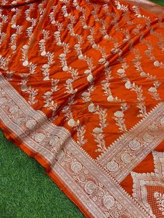 This is a very beautiful high quality mashru silk saree . All over zari motifs design with border . Saree length - 5.5 mtr. Blouse - 1 mtr. Dry clean only . Please note - color may be vary a little due to sunlight and photography . Please message us after purchasing in case you want fall and Pico done it not . No extra charges for fall and Pico but inform us . Blouse stitching is also available . Katan Silk Shawl For Wedding And Navratri, Elegant Orange Dupatta For Festivals, Designer Art Silk Saree With Traditional Patterns, Silk Dupatta With Traditional Patterns For Designer Wear, Orange Designer Saree With Dupatta, Elegant Jamawar Saree With Pallu, Elegant Orange Katan Silk Dupatta, Elegant Orange Katan Silk Saree, Elegant Jamawar Designer Saree