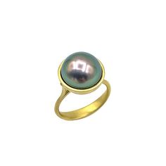 Tahitian Pearl Amazon Ring by Eve Streicker (Gold & Pearl Ring) | Artful Home Elegant Iridescent Round Jewelry, Elegant Round Iridescent Jewelry, Tahitian Pearl Gemstone Jewelry, Round Tahitian Pearl Gemstone Jewelry, Elegant Green Dome Ring With Polished Finish, Black Tahitian Pearl Ring, Elegant Tahitian Pearl Ring As A Gift, Yellow Gold Tahitian Pearl Ring, Elegant Iridescent Cabochon Ring